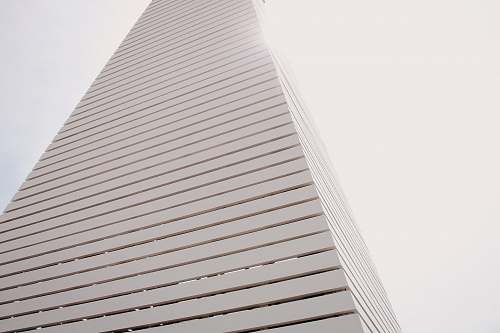 grey white high-rise building during day seaside